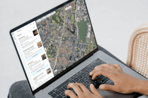 A person searching for local restaurants on a laptop using Google Maps to verify business pin locations and search result rankings.