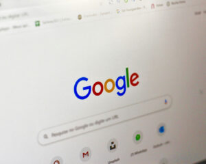 A laptop screen open to the Google search engine, ready for a search query, symbolising research or online discovery.