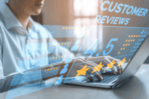 A person is shown typing on a laptop with a digital overlay displaying a 4.5-star rating and various customer reviews. The image visually represents the concept of online reputation management and consumer feedback in a modern, tech-focused style.